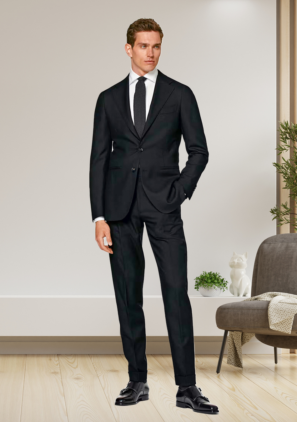 Black suit, white dress shirt, black tie, and black monk straps